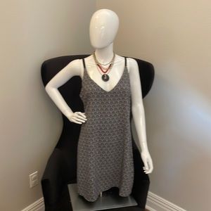 Black spaghetti strap dress; polyester and spandex